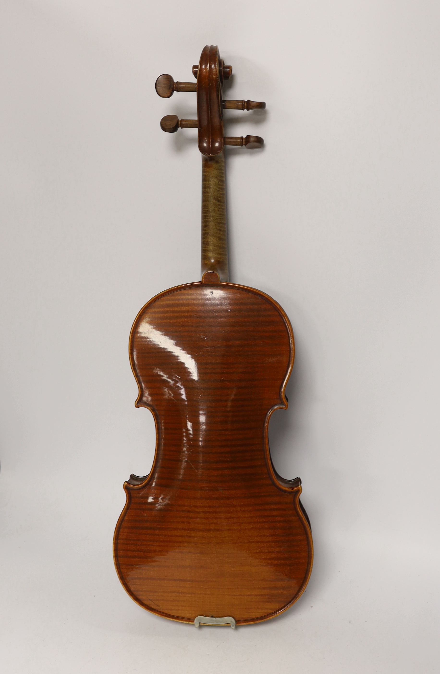 A French violin with a label for J. Nicolas Aine, a la Ville de Cremonne in an ebonised wooden case with outer canvas cover, body 36cm (without bow)